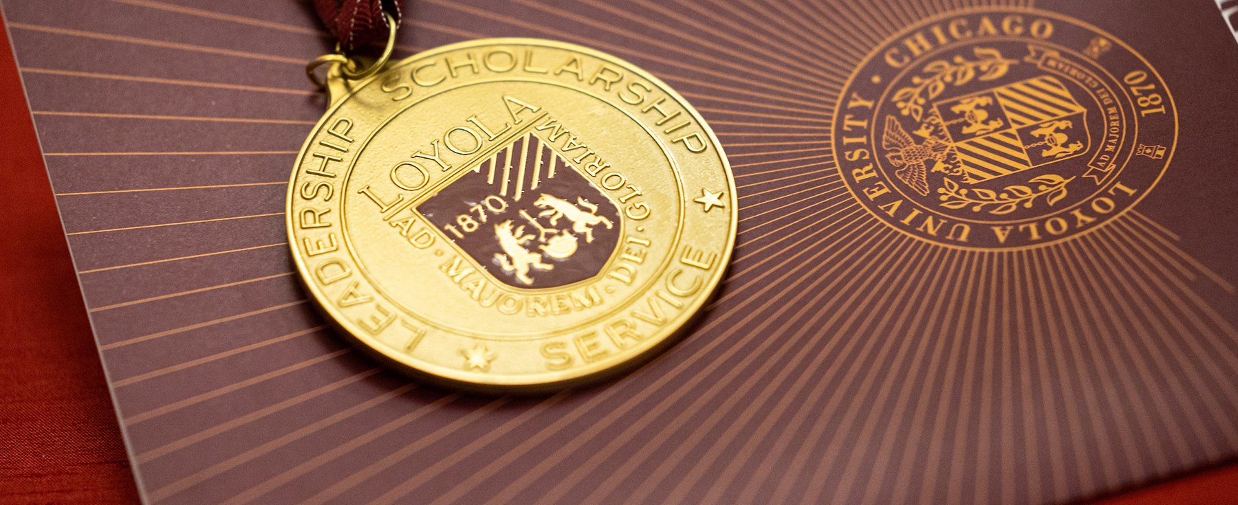 Gold Medal on Maroon Backdrop